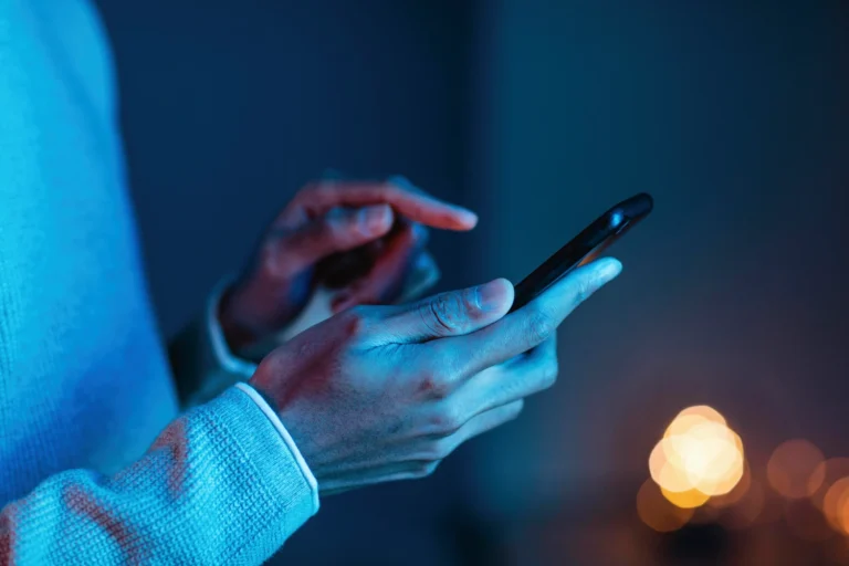 side-view-man-using-smartphone